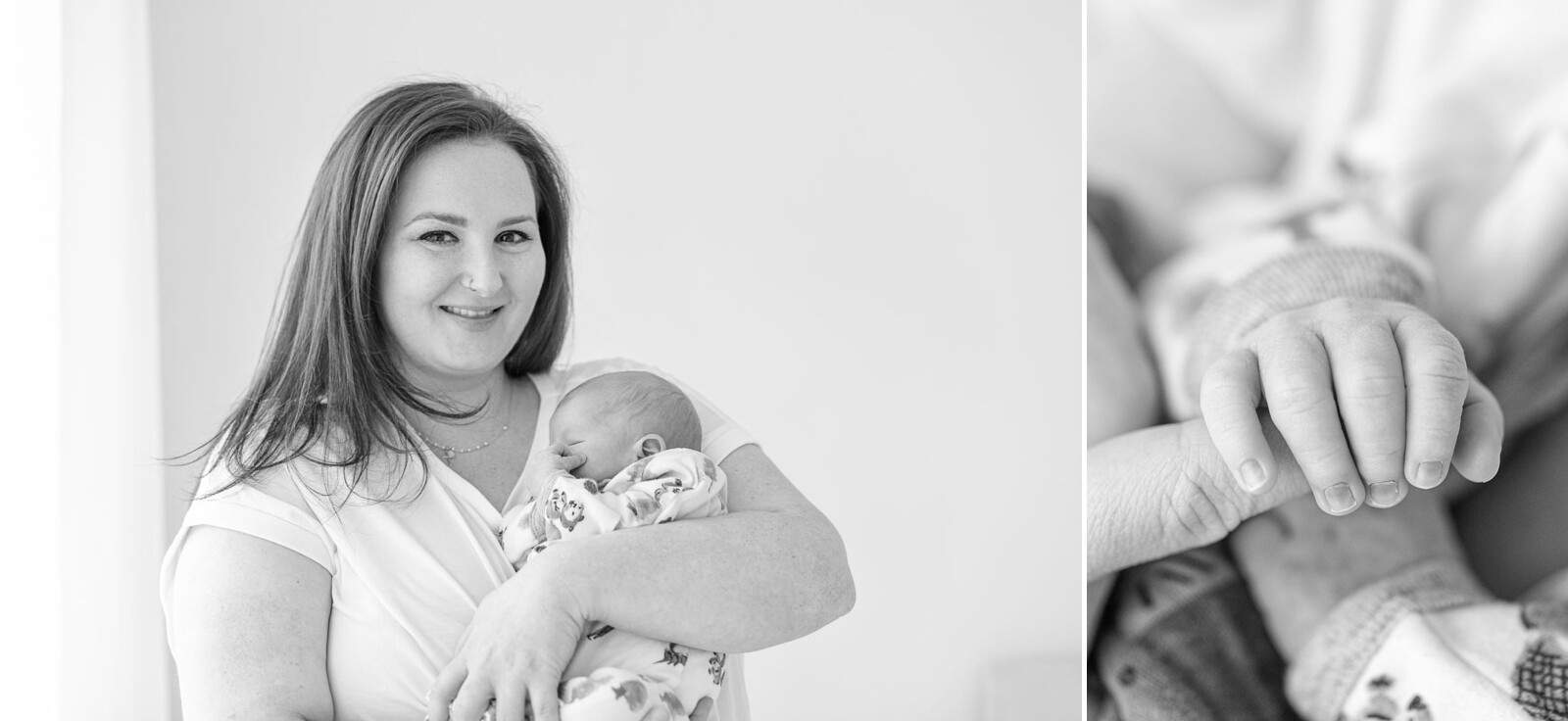 mother holds baby and smiles at camera